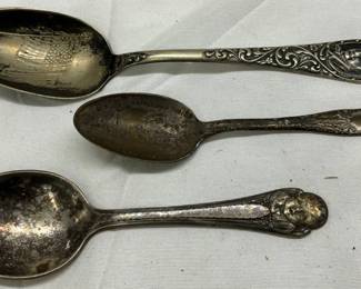 Three Decorative Silver-Plated Spoons with Ornate Handles
