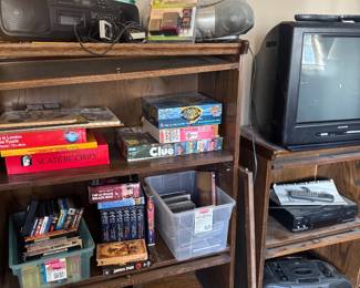 Two antiques cabinets DVDs and cds Nintendo remotes older tv 