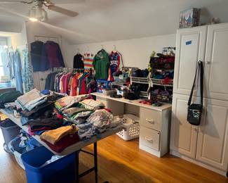 Lots of marathon cycle gear and accessories some purses, socks, hats and gloves 