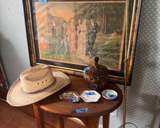 Several hats round cherry table 