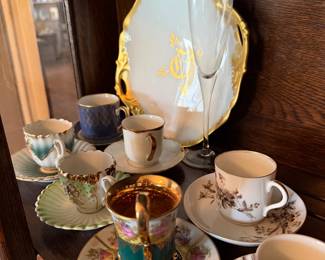 Lots of beautiful teacups and saucers 