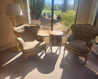 Two upholster chairs, table and floor lamp