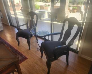 Two wood and upholstered chairs and  table