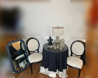 Mercury Glass Decor With Black Wooden Chairs And Mirror