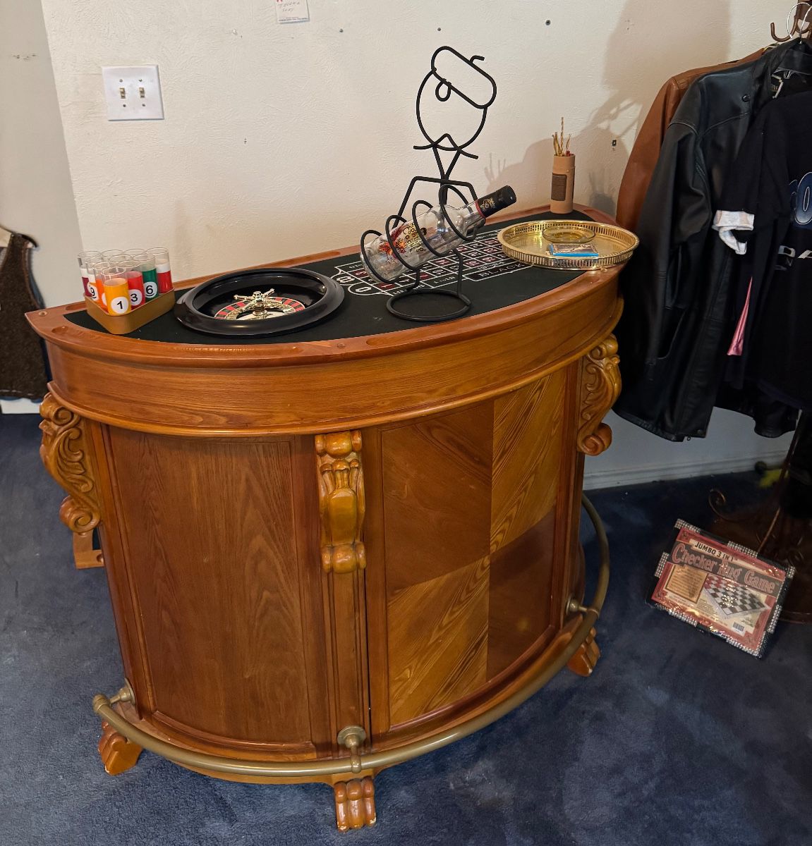 Bar with wine and liquor storage with 3 game table options or wood top