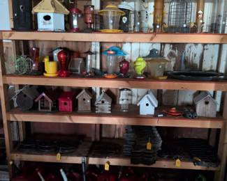 Collection of bird feeders, bird houses, small fence panels, fuel cans