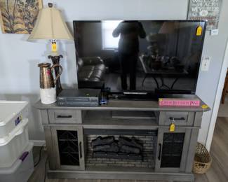 Faux fireplace, TV, lamps