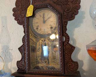 8 different antique clocks, including one mantle clock and a grandfather clock