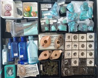 Old bottles, marbles, coins, turquise and the kind of lamps that genies come out of