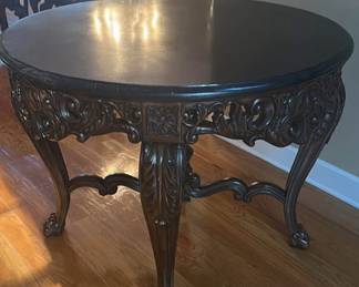 This is a beautiful foyer table about 44 inches round 