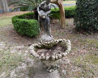 Fabulous women pouring water bird bath 