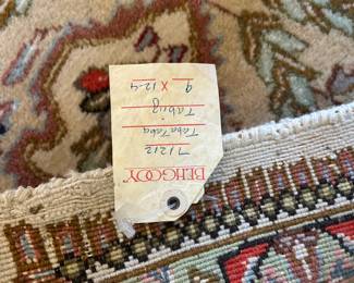 9x12 hand tied wool rug.