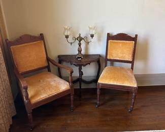 Stunning antique chairs with yellow velvet upholstery.