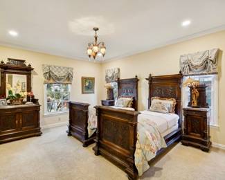 Bedroom suite with pair of twin size beds, rich patina, aged wood. Adorned with exquisite carved details. Classic elegance and charm.