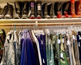We have two packed men's closets.  This one is more military, outdoor clothing.  Tons of boots.