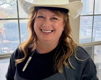 Stacie in a cowboy hard hat!