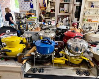 Stuffed kitchen with Le Creuset, vintage yellow Mid Century Danish Copco cookware.