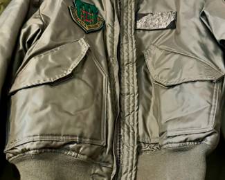 Vietnam pilot with so many aviator uniforms, patches, pins.  Lockheed Martin stuff too!