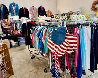 Large master bedroom stuffed full!  Women's clothing, handbags, shoes, costume jewelry.  Linens, Toys, Baby Products.