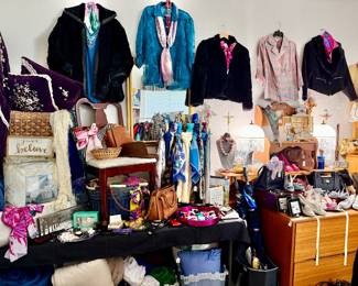 Women's wall with 4 rabbit furs, handbags, shoes, and costume jewelry.