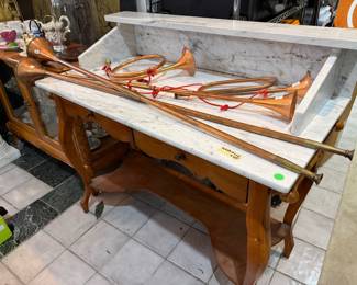 Antique Marble washstand with copper hunting horns including the 2 long antique copper horns.