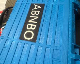 Blue heavy-duty plastic storage case with "ABNBO" label.