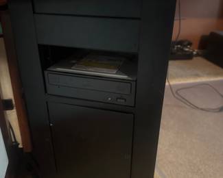 Tall black tower computer case standing upright on the floor.