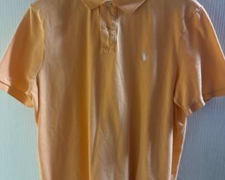 Orange short-sleeve polo shirt with collar and small embroidered logo on the chest.