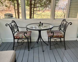 Bistro set, on indoor porch.
