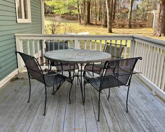 4 metal patio chairs, mosaic tile table. Chairs could use a splash of paint