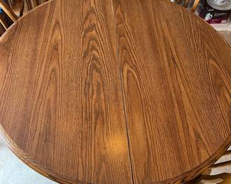 Round Oak Pedestal Dining Table with Leaf