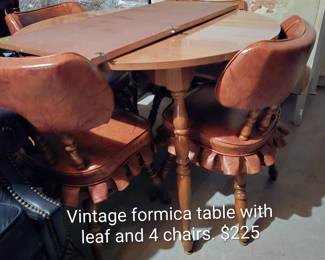 Vintage Formica table with leaf and 4 chairs $225.  In excellent condition - can't even tell it was used!