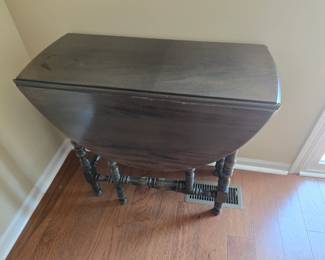 Walnut antique gate leg table, bobbin leg, drop leaf.  Small water stain top left.  $175