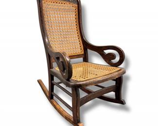 60 VintageChildsWoodenCaneSeatRockingChairwScrollArms