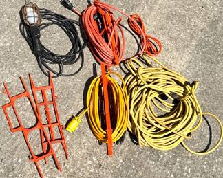 Lot of 4 Extension Cords, a Portable Work Light and 3 Extension Cord Winders 
