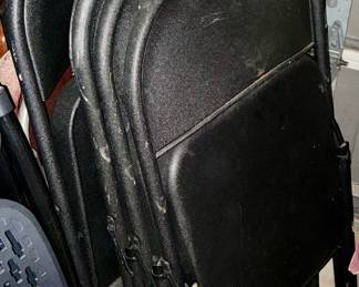 Set up six black folding chairs