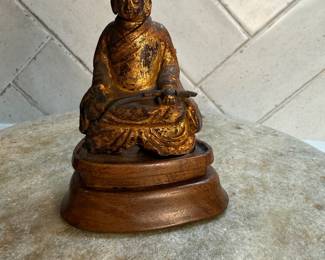 	#131	"A Chinese Statue of a Buddhist Saint with Traces of Gilt on a Wooden Stand from the Qing Dynasty - 225 Years Old [4.25 inches tall on attached stand]"	 $100.00 				
