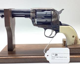 Strum Ruger Vaquero 45 cal. Classis western 6 shot features jeweled hammer, trigger and eagle grips. It is holstered with a custom leather belt and holster. All guns, pistols, rifles and shotguns are subject to FFL firearms regulations