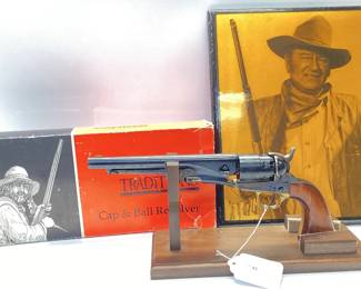 Traditions 1860 Colt Army 44.cal percussion Italian made pistol FR18602 Colt 1860 Army Replica in .44 cal black powder with original box. Includes picture of the iconic John Wayne