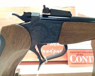  Thompson Center Arms Contender 44 Rem. Mag. This pistol is in mint condition. Looks to be never fired, in original box with paperwork and instructional VHS. All guns, pistols, rifles and shotguns are subject to FFL firearms regulations.