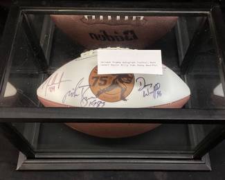AUTOGRAPHED WINNERS 75th ANNIVERSARY HEISMAN TROPHY FOOTBALL, 1978 BILLY SIMS #20 OKLAHOMA SOONERS, 1983 MIKE ROZIER #30 NEBRASKA CORNHUSKERS, 1996 DANNY WUERFFEL #7 FLORIDA GATORS, 2004 MATT LEINART #11 USC TROJANS IN DISPLAY CASE NO SHIPPING PICKUP ONLY