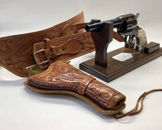 Strum Ruger Vaquero 45 cal. Classis western 6 shot features jeweled hammer, trigger and eagle grips. It is holstered with a custom leather belt and holster. All guns, pistols, rifles and shotguns are subject to FFL firearms regulations