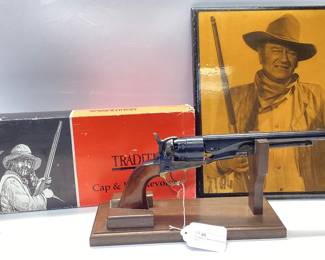 Traditions 1860 Colt Army 44.cal percussion Italian made pistol FR18602 Colt 1860 Army Replica in .44 cal black powder with original box. Includes picture of the iconic John Wayne