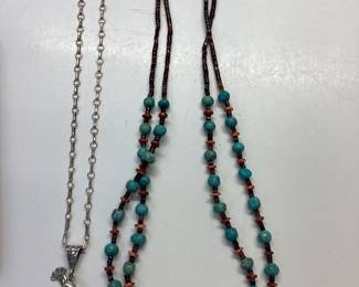 NATIVE AMERICAN STERLING SILVER NECKLACE KOKOPELLI PENDANT ALONG SIDE A TURQUOISE AND CORAL BEADED NECKLACE 13.90 grams