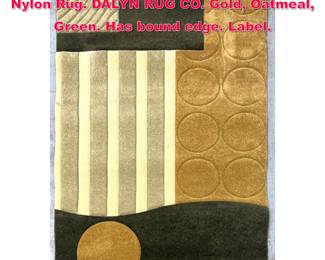 Lot 328 4 11 X 8 ELEMENTS DESIGN 16 Nylon Rug. DALYN RUG CO. Gold, Oatmeal, Green. Has bound edge. Label. 