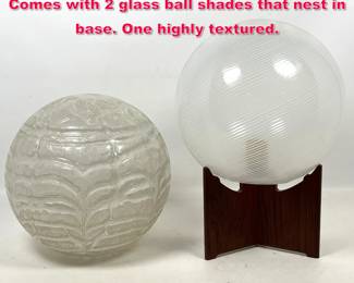 Lot 406 Teak Base Modern Design Lamp. Comes with 2 glass ball shades that nest in base. One highly textured.