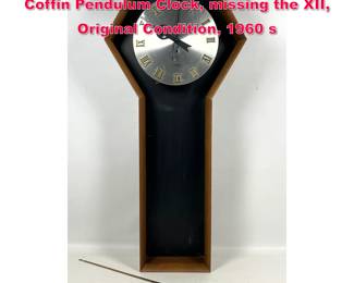 Lot 195 Arthur Umanoff for Howard Miller, Coffin Pendulum Clock, missing the XII, Original Condition, 1960 s