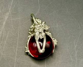 dragon claw pendant features a red crystal orb