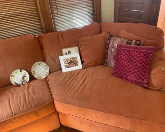 Orange upholstered couch with two pieces…a bit faded, very comfortable