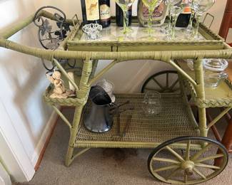 Green wicker bar cart with tray top